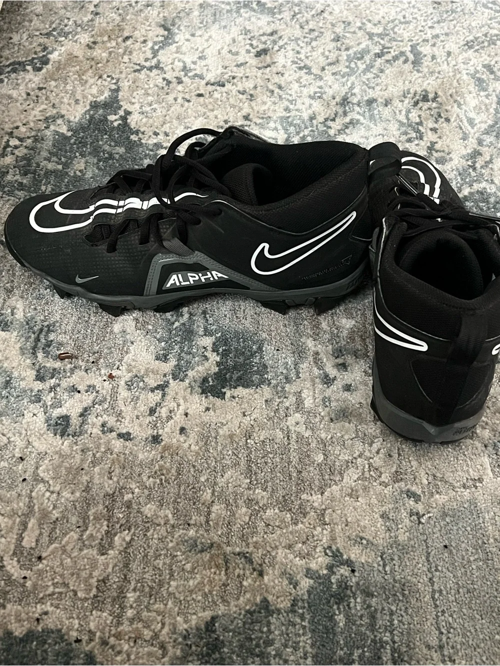 Nike Black Football Cleats with White Swoosh Accents